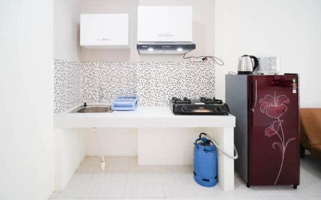 Cozy Living And Tidy 2Br At Puncak Dharmahusada Apartment