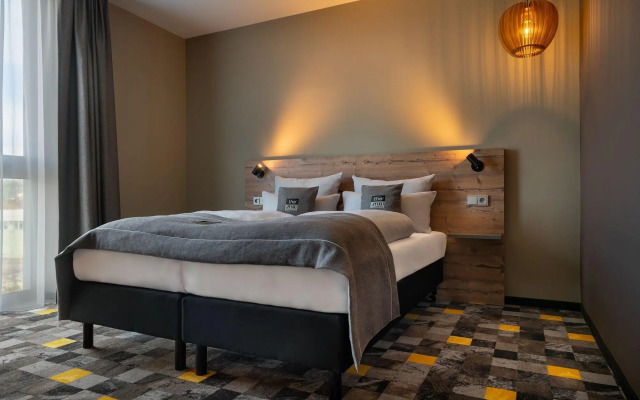 Отель Holiday Inn - the niu, Timber Esslingen, an IHG Hotel