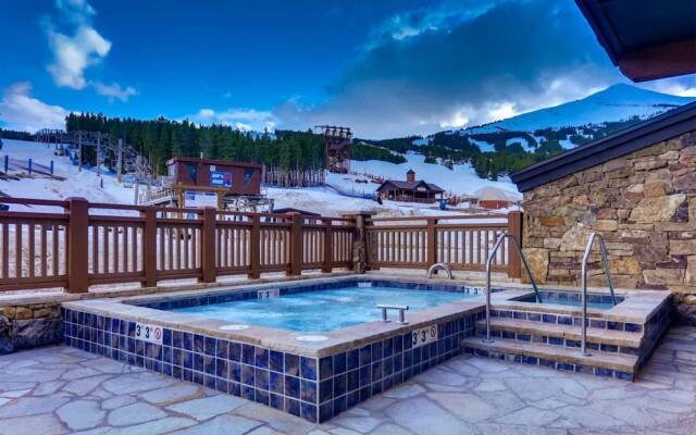 Expansive 4 Bedroom Ski in, Ski out One Ski Hill Residence Located at the Base of Peak 8 with Beautiful Views