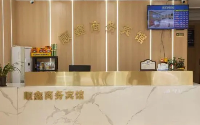 Changxing county shun xin business hotel
