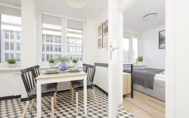 Grey Apartment Śródmieście by Renters