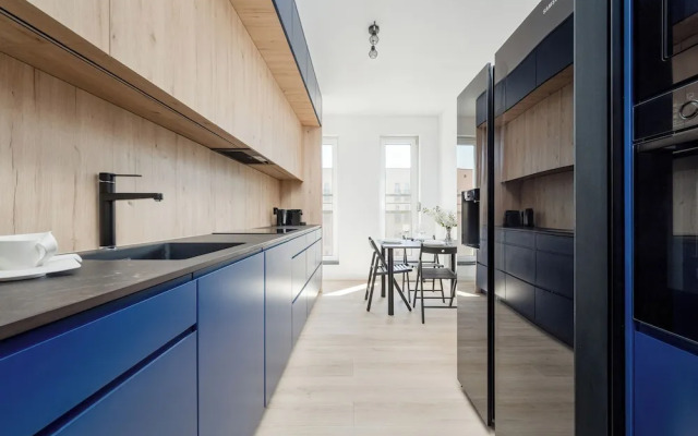 Wroclaw Dark Blue Apartment by Renters