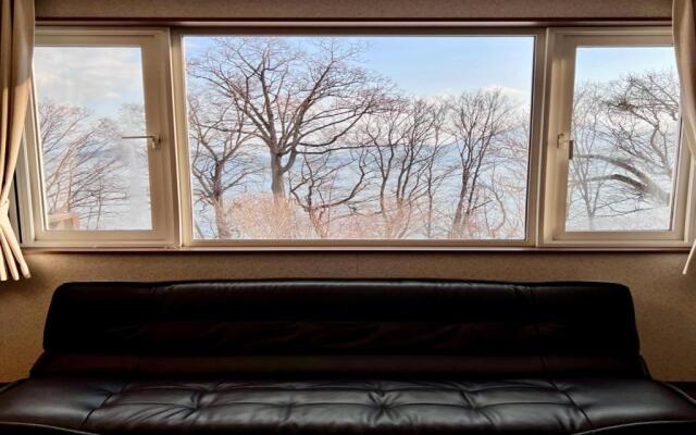 Yellow House by Lake Toya