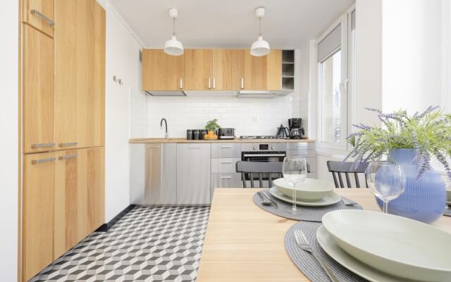 Grey Apartment Śródmieście by Renters