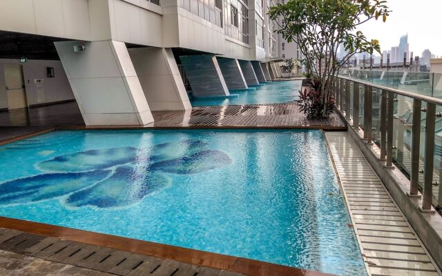 Luminous 2 Bedrooms at Menteng Park Apartment by Travelio