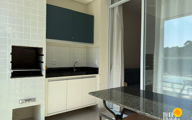 Apto completo e confortável com roupa de cama nas Toninhas  Condomínio Lumière