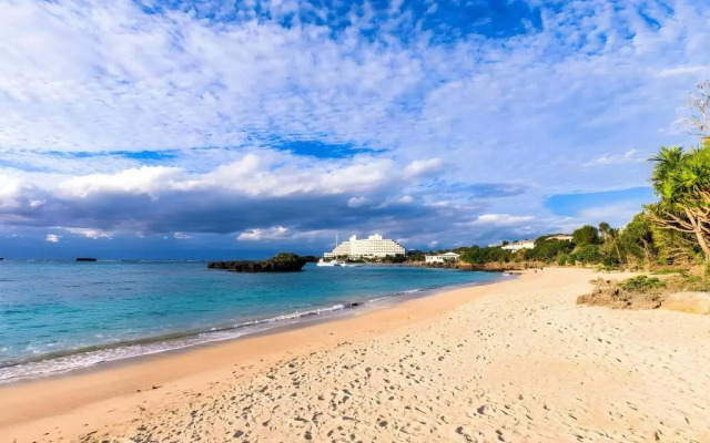 Mr.KINJO in front of Manza Beach