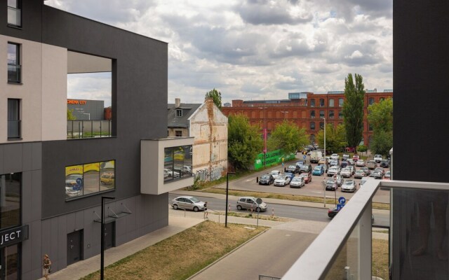 Studio Near Manufaktura Łódź by Renters