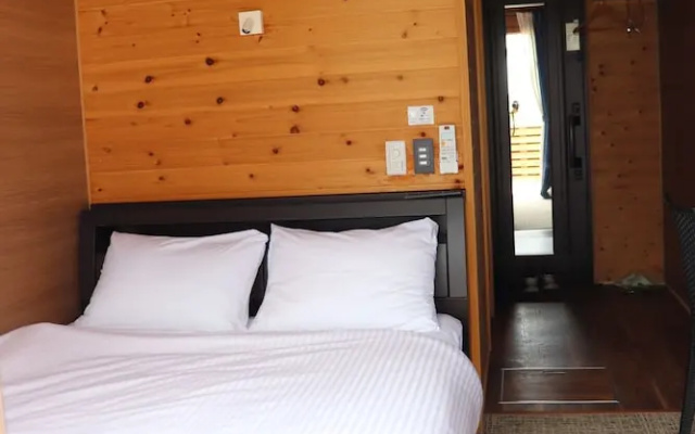 Log Inn Tarasso (okinoerabu Island) – Guest Rooms – Wadomari