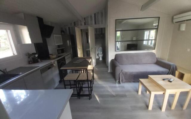 Chalet T3/clim/wifi/pkg/terrasse/15 min plages