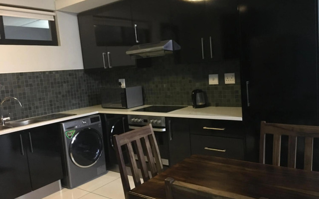 Highrise Windhoek apartment with skyline view, pool and gym