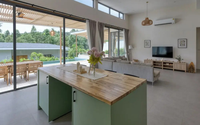 Tropical Poolside Retreat by Sea N' Rent