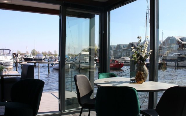 Cozy houseboat at the edge of the marina with beautiful view