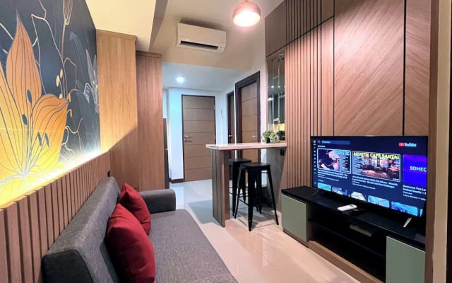 Warm And Homey 2Br At Vida View Makassar Apartment