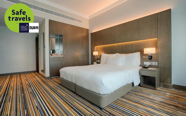 Отель Naumi Dubai