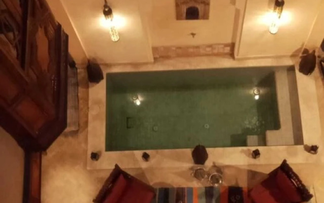 "room in Guest Room - Riad Lakouas Triple Room With Pool View"