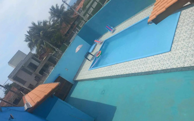 CASA DE PRAIA CARAGUA COM Piscina