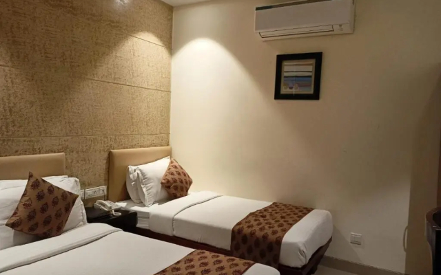 Cosy Grand @Chanakyapuri by The Cosy Hotels.