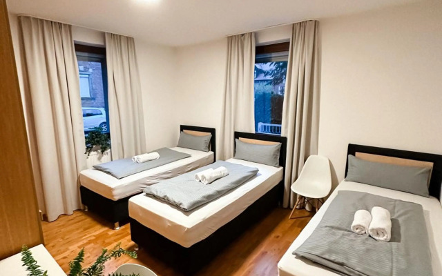 Suiteable Living - Boardinghaus mit Parkplätzen, WLAN und Waschraum