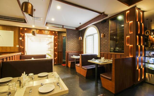 Capital O 15964 NI Ambaari Suites