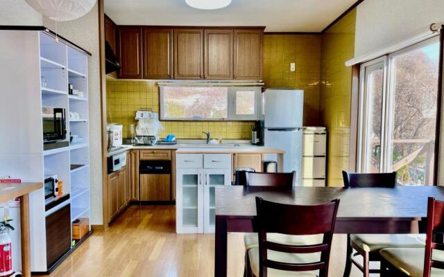 Yellow House by Lake Toya