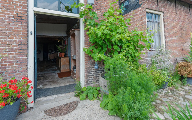 Farmhouse by Lauwers River With Rowing Boat