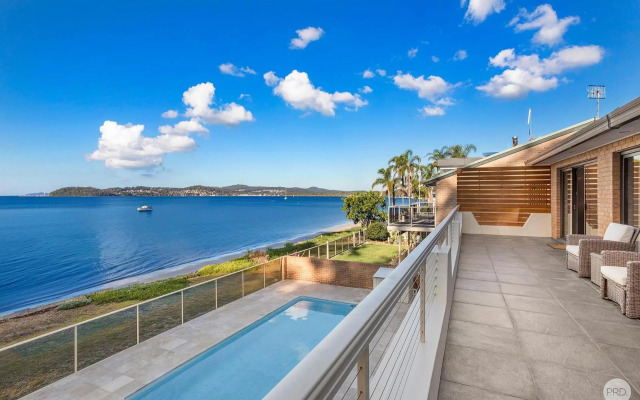 Seaside Sanctuary - Waterfront Luxury Home with Heated Pool