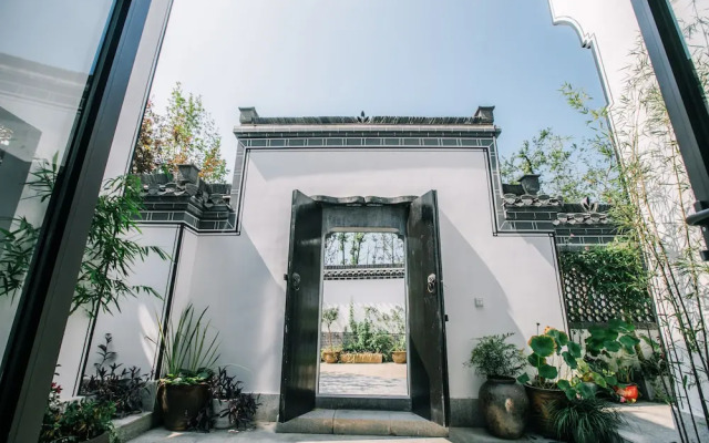 Xinhualian Lv Xin Gu Hotel