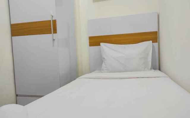 Comfy and Homey 2BR at Vida View Apartment By Travelio