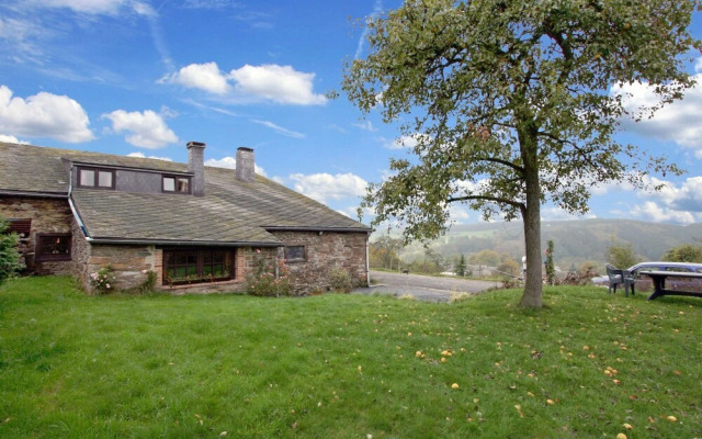 Farmhouse Situated at the Edge of the Woods