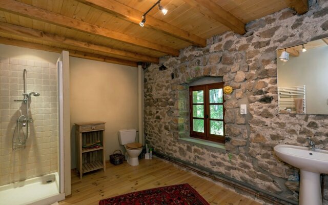 Beautiful Stone Farmhouse in Mountain Forest Setting