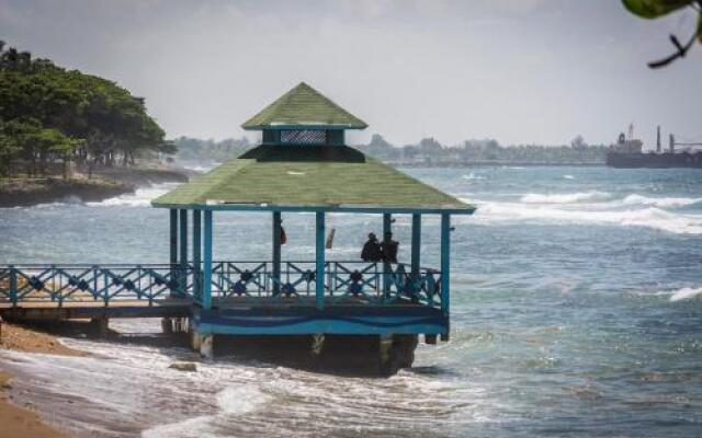 Malecon Rooms y Hotel
