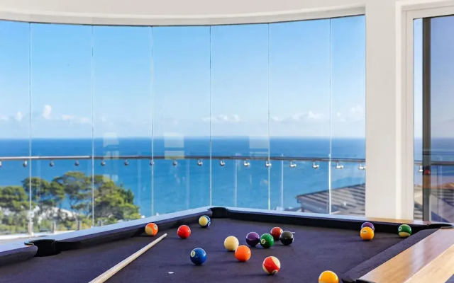 Cliffside Castle With Bay And City Views
