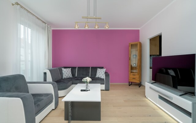 Dark Grey and Pink Apartment by Renters