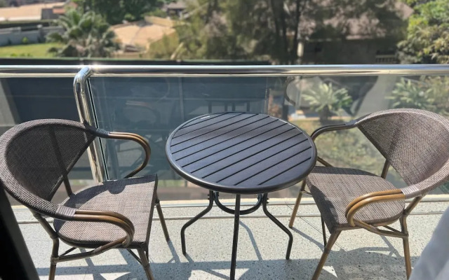 Q-Plus Apartments