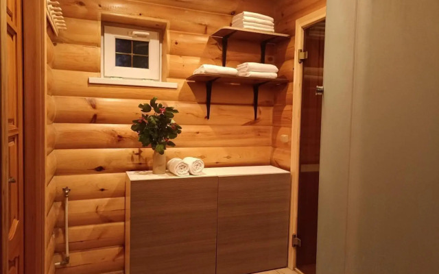 Log house with a Russian wood-burning sauna