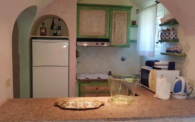 House with 3 bedrooms in Cannigione with wonderful sea view enclosed garden and WiFi 600 m from the beach