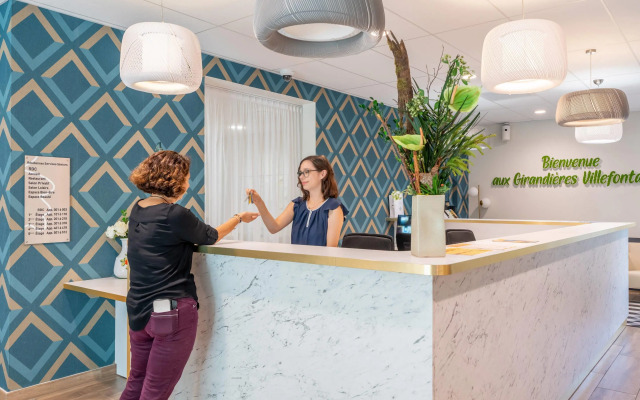 Quality Suites Villefontaine