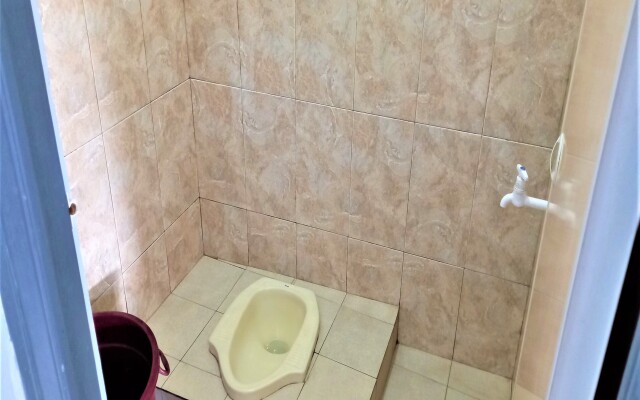 Nabila Syar i Guesthouse by ZUZU