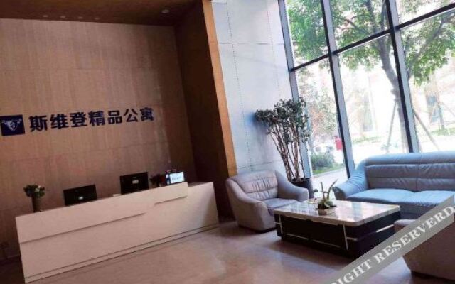 Xinyueju Boutique Apartment (Shishi Clothing City Shimao Skyscraper City Branch)