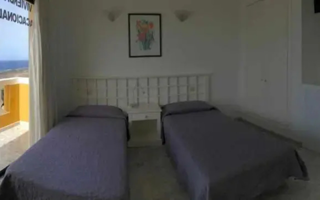 VV 121 con Balcón en primera línea de mar