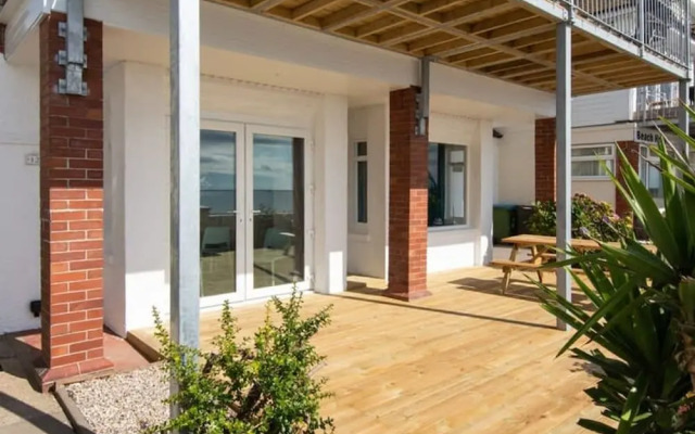 Absolute Beachfront With Decked Garden Oasis and Views