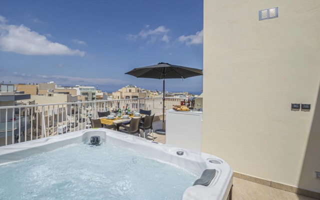 Summer Breeze Penthouse with large Terrace and Hot Tub by Getaways Malta
