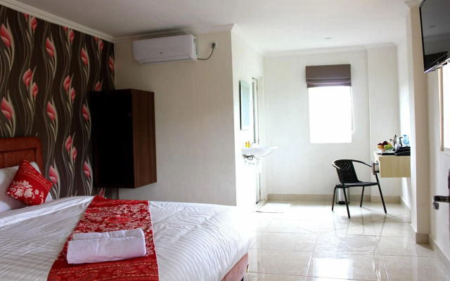 Airy Mapanget AA Maramis Manado