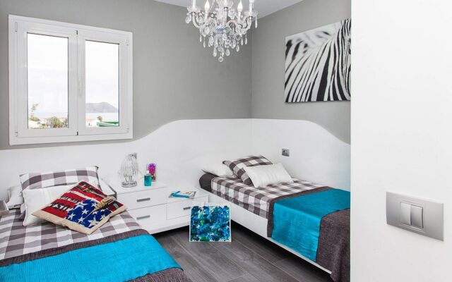 Coral Bay Beachfront Apartment by Vacanzy Collection