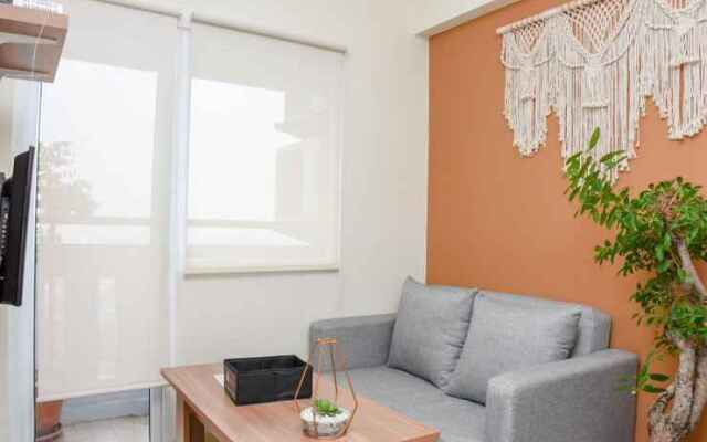 2BR Green Pramuka City Apartment by Travelio