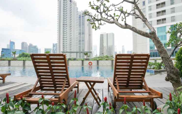 Amazing 1BR at The Wave Rasuna Epicentrum By Travelio