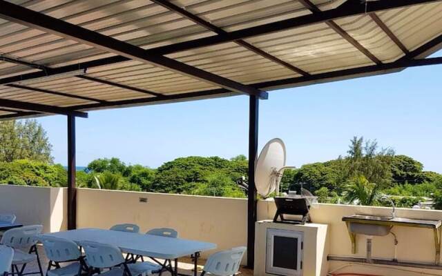 Apartment With 2 Bedrooms in Flic en Flac, With Wonderful sea View, Shared Pool, Furnished Garden