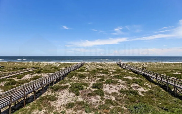 Newly Remodeled Oceanfront Condo with Salt Water Pool and Private Walkway to Beach by RedAwning