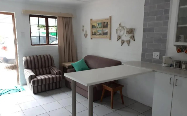 Cozy 4 bedroom house enclosed by sea and mountain.
